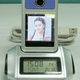 Illustration for article titled Portable Digital Frame, Webcam and Alarm Clock All-In-One